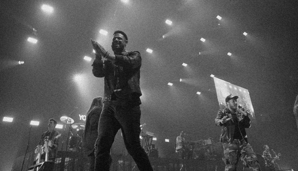 Pastor Steven on stage with Elevation Worship